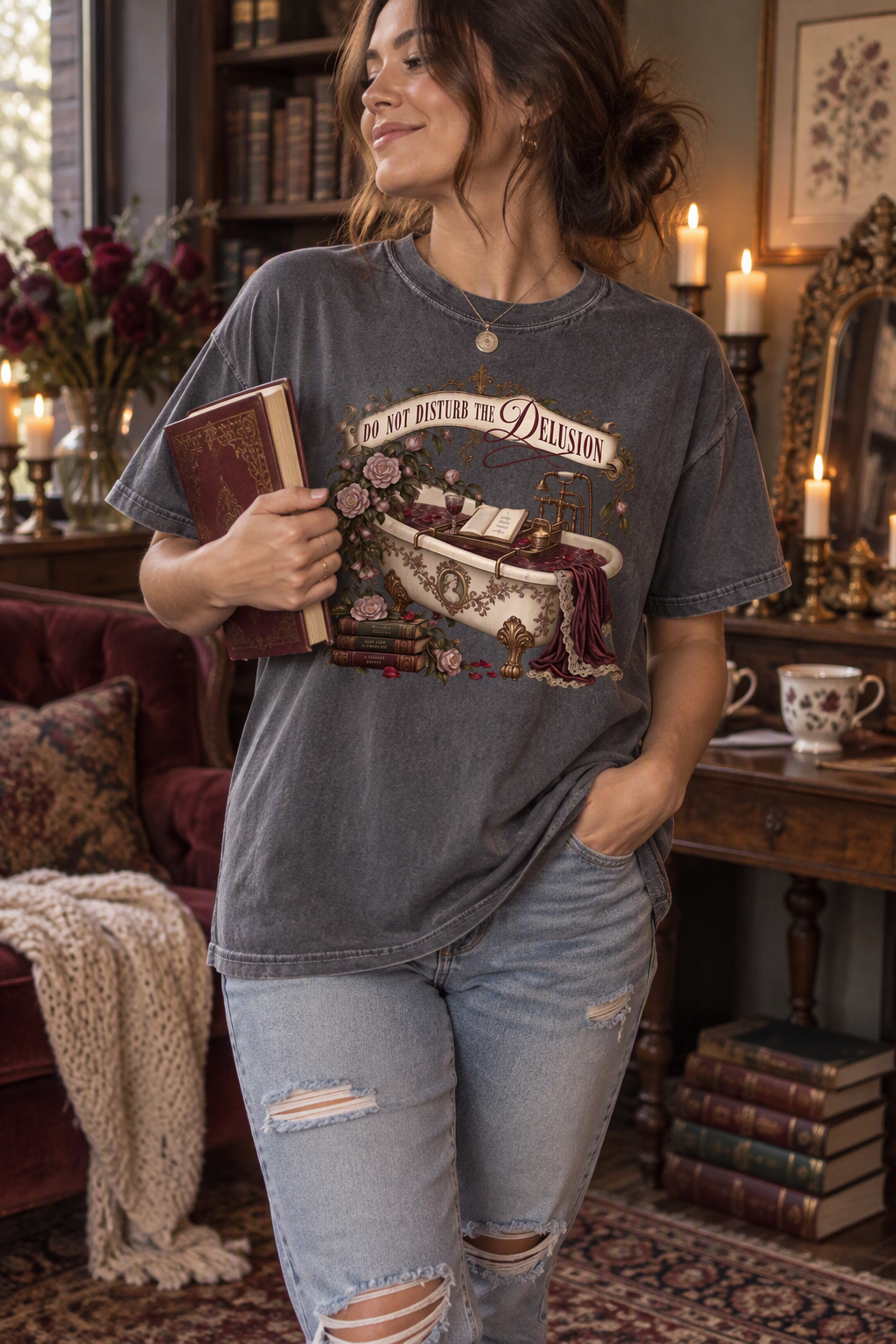 Do not disturb the delusion—the fictional world is better right now. This romantic gothic book lover shirt features an ornate antique bathtub surrounded by an open book, burgundy velvet, tea, vintage books, mauve roses, and beautiful brass details. The soft Comfort Colors tee has a relaxed unisex fit that is perfect for book club, bookstore trips, reading weekends, or cozy self-care days. A thoughtful gift for dark romance readers, romantasy fans, BookTok followers, librarians, and anyone who would rather b