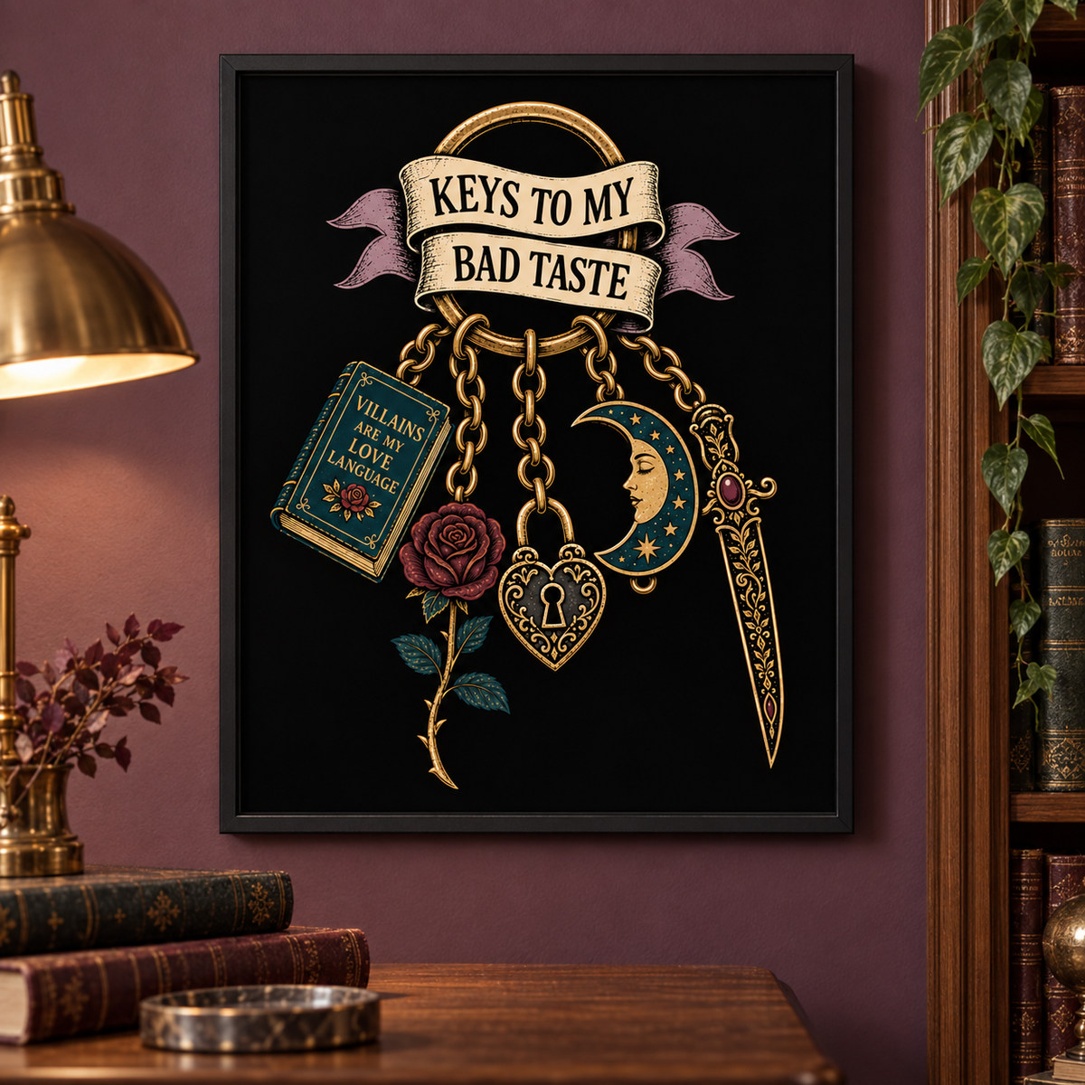 A framed wall art print hanging on a dark purple wall in a styled room. The artwork features a black background with a gold ring and banner reading 'KEYS TO MY BAD TASTE,' plus decorative charms including a rose, lock, dagger, crescent moon, and book.