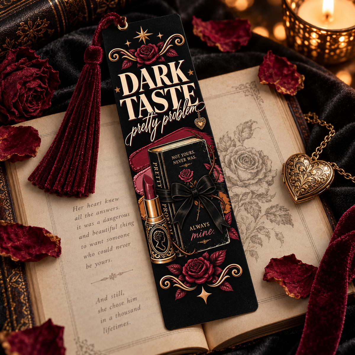 A dark velvet bookmark with a tassel, featuring gothic text and an illustration of a lipstick bottle, styled on an open book with rose petals, a gold heart pendant, and a candle.