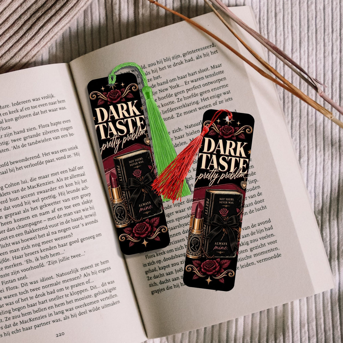 Two Dark Taste Poly Pouches with colorful bookmarks (one green, one red) resting on an open book, with wooden chopsticks on a white wood background.