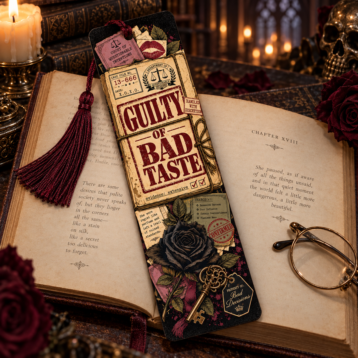 A decorative gothic bookmark styled on open vintage books with candles, roses, and a pair of round glasses nearby. The bookmark features a ticket design reading 'Guilty of Bad Taste' with a tassel, floral and key details, and a dark rose illustration.