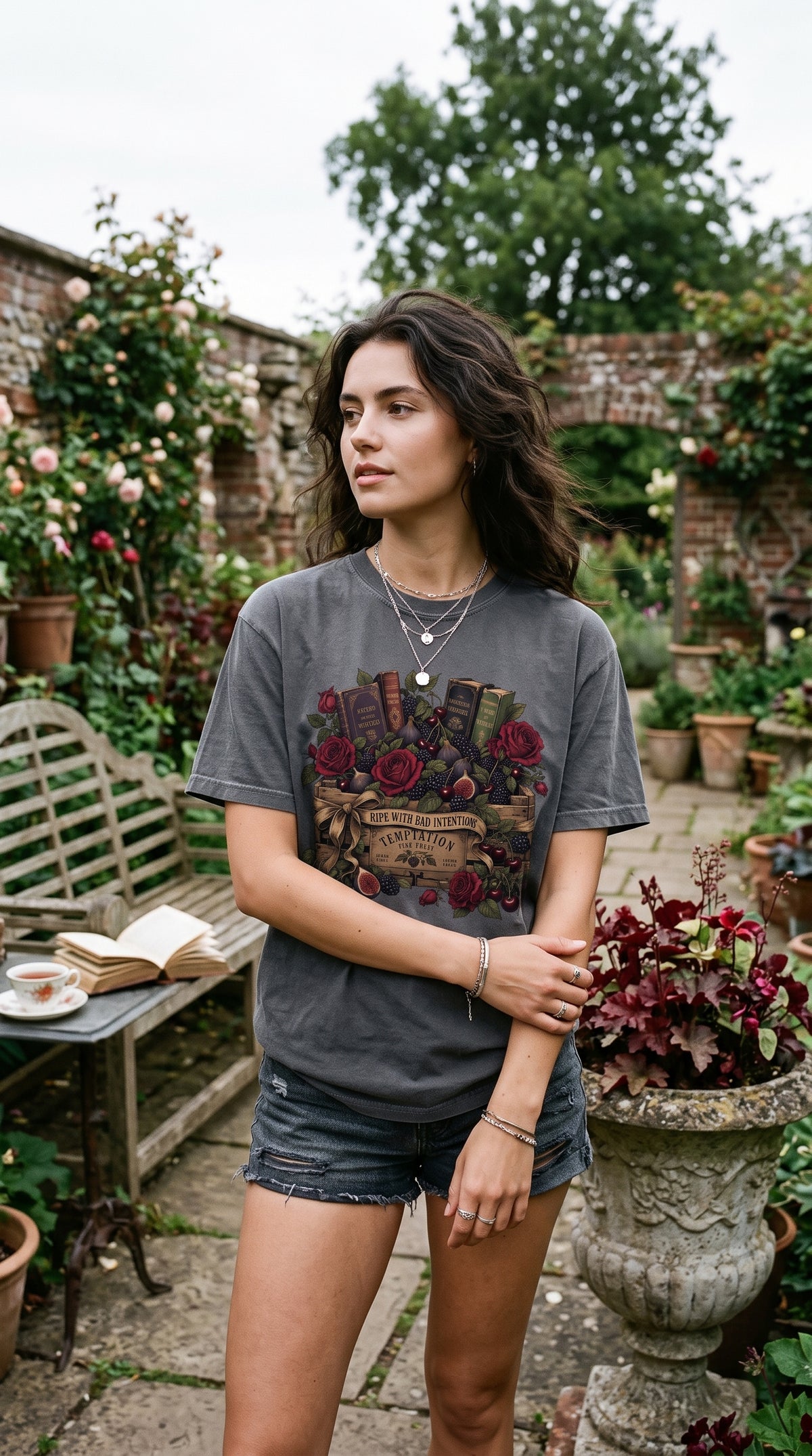 A little dark academia, a touch of gothic romance, and plenty of temptation for your next chapter. This “Ripe With Bad Intentions” book lover shirt features antique books, burgundy roses, figs, cherries, and moody botanical details on a soft garment-dyed tee. Available in Espresso, Blue Jean, Ivory, Moss, Pepper, Butter, and White for romance readers, romantasy fans, and lovers of beautifully bookish style.