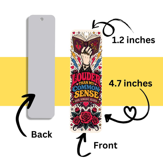 A book-themed bookmark shown with front and back views on a white background with a yellow horizontal band. The back is plain gray, and the front features colorful illustrated artwork of a hand holding an open book with the text 'LOUDER THAN MY COMMON SENSE' and 'ROMANCE READER.