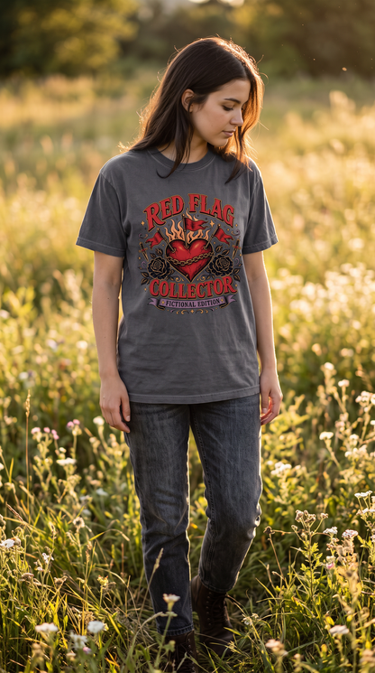 For readers who see the red flags and keep turning the page anyway. 🖤🚩 The Red Flag Collector, Fictional Edition Shirt features a bold chained heart surrounded by red flags, black roses, daggers, flames, and vintage gothic details. Perfect for dark romance readers, romantasy fans, BookTok lovers, morally gray hero fans, and anyone who collects fictional red flags for fun.

#RedFlagCollector #DarkRomance #BookLoverShirt #RomantasyReader #BookTokStyle #MorallyGray #FictionalMen #BookishFashion #ReaderGift #