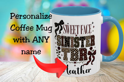 A white coffee mug with a blue handle and interior, featuring the text 'SWEET FACE SINISTER TDR Leather' in decorative lettering. The mug is shown on a wooden surface with a colorful blurred background, and text on the left reads 'Personalize Coffee Mug with ANY name' with a red arrow pointing to the mug.