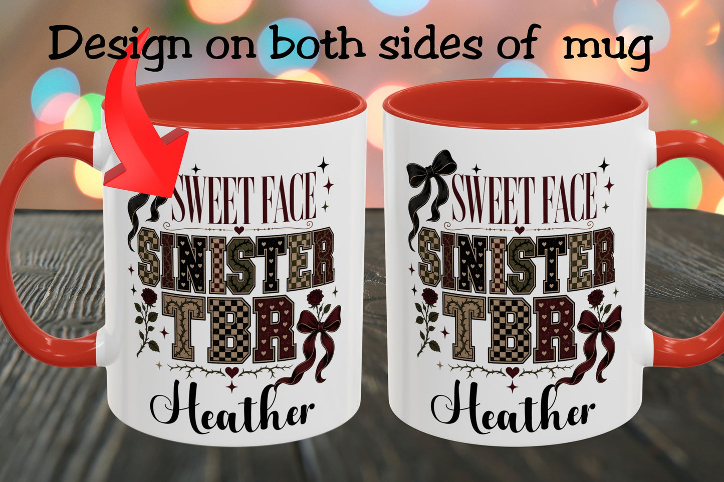 Two views of a white ceramic mug with a red handle and red interior, shown on a dark wooden surface with colorful blurred lights in the background. Text at the top says 'Design on both sides of mug' with a red arrow pointing to the left mug, which features the printed design: 'SWEET FACE SINISTER TDR Heather'.
