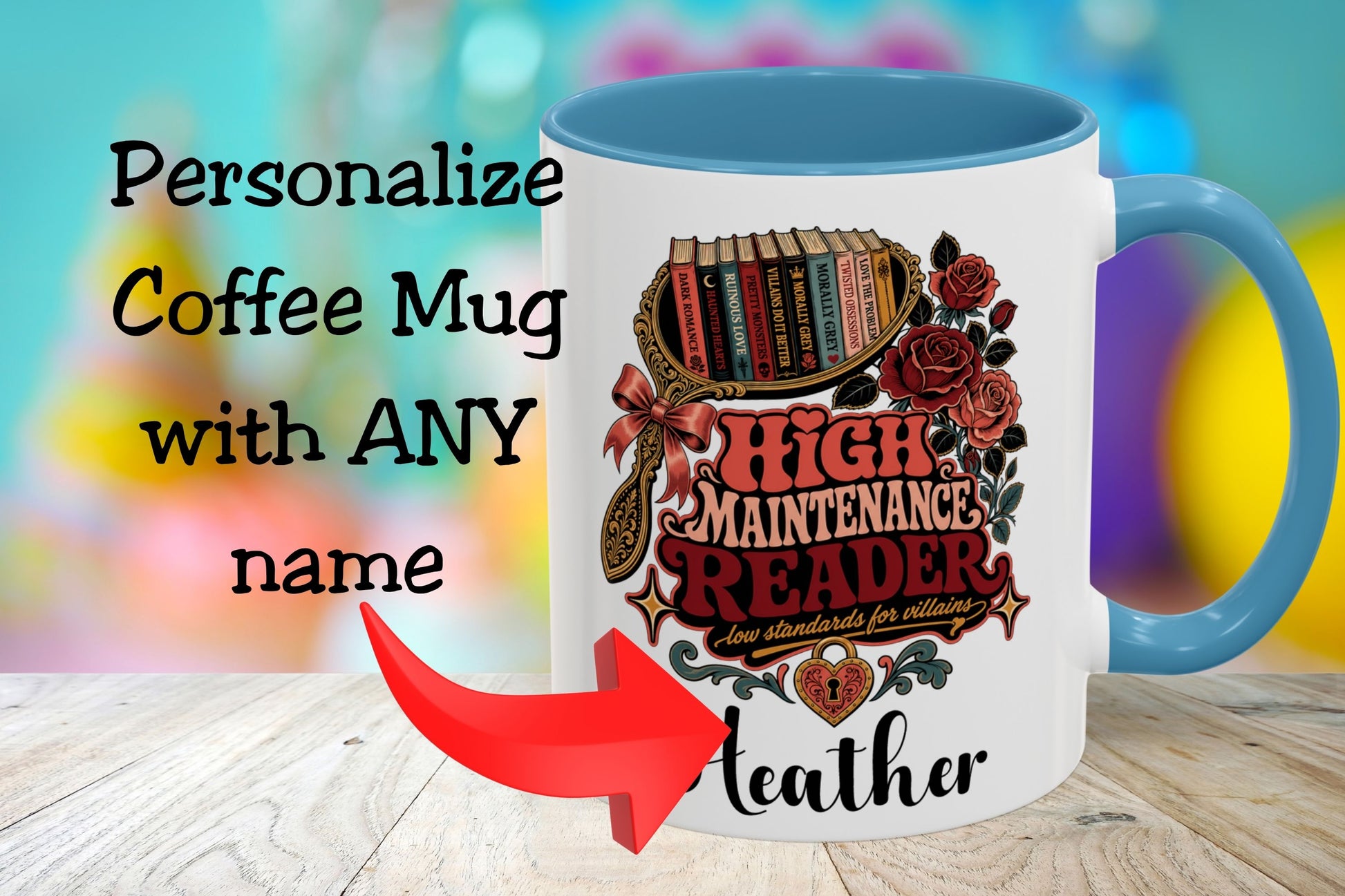 A white ceramic coffee mug with a blue handle and interior, featuring a decorative graphic of books, roses, and the text 'HIGH MAINTENANCE READER' with 'Leather' printed below. Large overlaid text says 'Personalize Coffee Mug with ANY name' with a red arrow pointing to the mug.