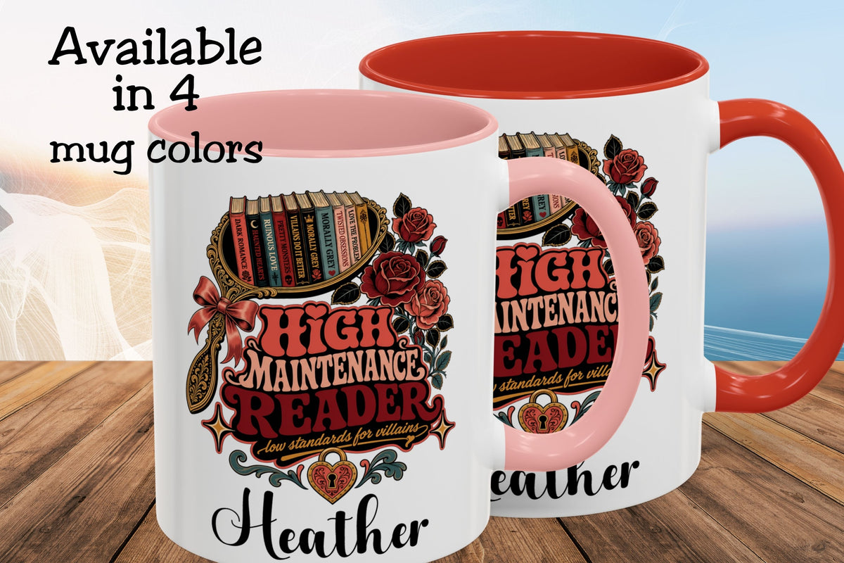 Two white ceramic mugs with pink interiors and handles are shown on a wooden surface with a blurred beach background. Text in the upper left reads 'Available in 4 mug colors.