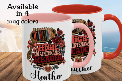 Two white ceramic mugs with pink interiors and handles are shown on a wooden surface with a blurred beach background. Text in the upper left reads 'Available in 4 mug colors.