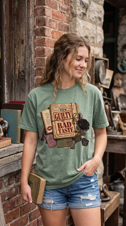 Guilty of questionable fictional choices and not interested in an appeal. This dark romance reader shirt features a distressed vintage case-file design with black roses, antique keys, stamps, literary ephemera, and bold “Guilty of Bad Taste” typography. A fun BookTok shirt for morally gray hero fans, villain lovers, romance readers, and book club friends. #DarkRomanceShirt #BookishShirt #RomanceReader #BookTokGift #VillainRomance