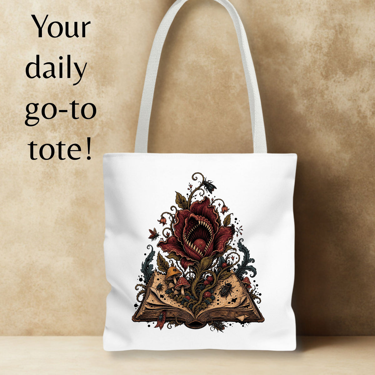 A white canvas tote bag with a gothic illustration of an open book and a red rose, set against a textured beige background with the text 'Your daily go-to tote!' on the left.