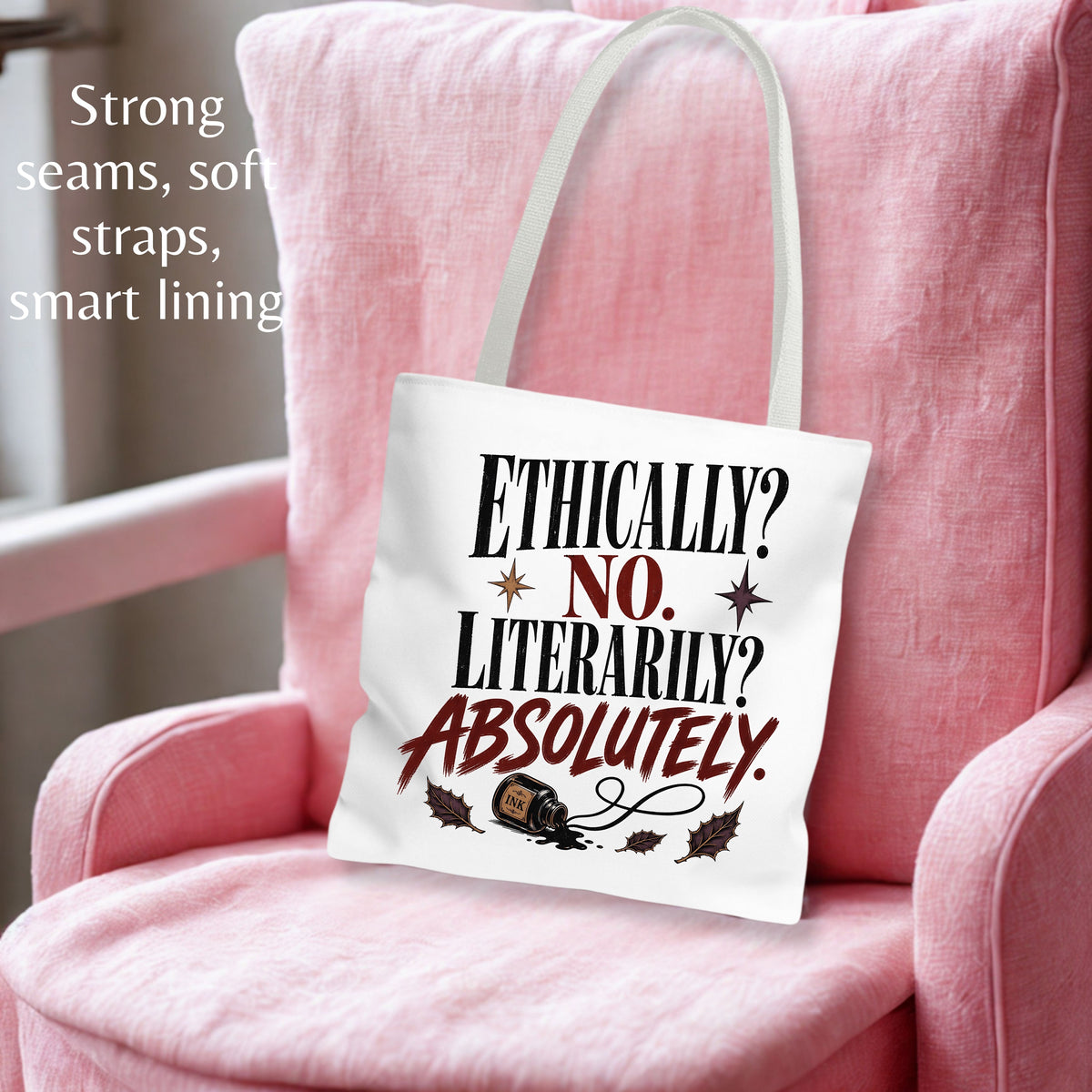 A white canvas tote bag with printed text and a tape measure graphic, resting on a pink armchair. The text on the bag reads 'ETHICALLY? NO.