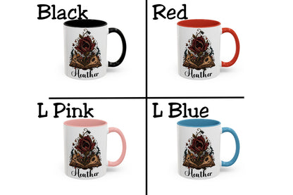 A 2x2 grid showing four color options for a ceramic mug with a floral book illustration and the name 'Heather' printed below. The options are labeled Black, Red, L Pink, and L Blue, each showing the mug interior and handle color against a white background.