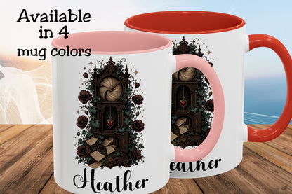 Two white ceramic mugs with pink and orange-red interiors and handles, shown on a wooden surface with a blurred beach background. The mugs feature a dark gothic illustration of a clockwork mechanism with roses and the name 'Heather' printed below.