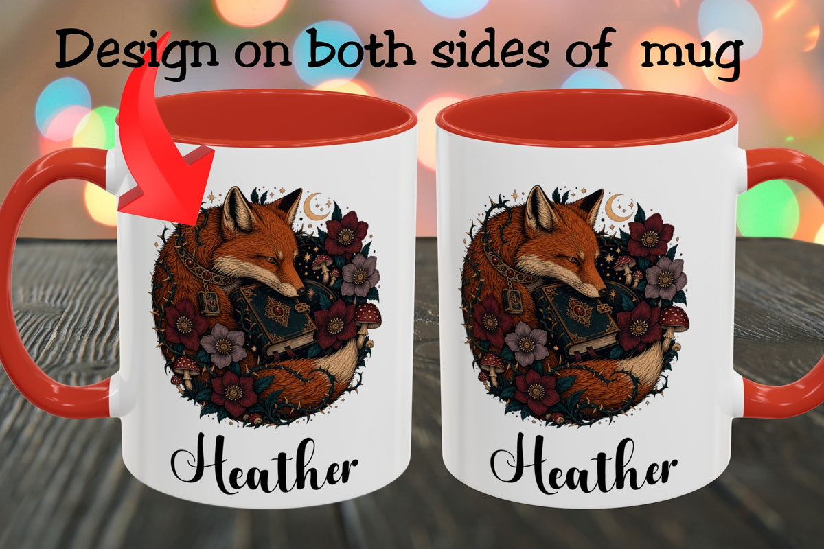 A white ceramic mug with a red handle and red interior, shown twice side by side to demonstrate design placement on both sides. The front design features an illustrated fox surrounded by flowers and the name 'Heather' in script.