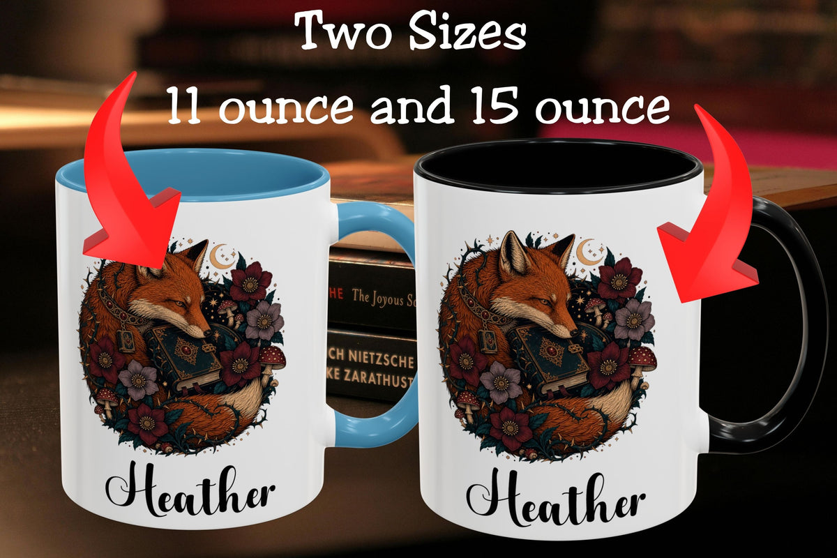 Two personalized ceramic mugs shown side by side with text reading 'Two Sizes 11 ounce and 15 ounce.' The left mug has a blue interior and handle, and the right mug has a black interior and handle.