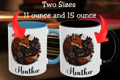 Two personalized ceramic mugs shown side by side with text reading 'Two Sizes 11 ounce and 15 ounce.' The left mug has a blue interior and handle, and the right mug has a black interior and handle.