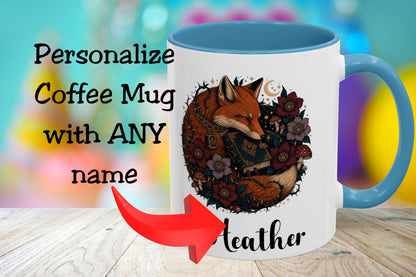 A white coffee mug with a blue handle and interior, featuring an illustrated fox surrounded by flowers and the name 'Leather' printed below. Large text on the left reads 'Personalize Coffee Mug with ANY name' with a red arrow pointing to the mug.