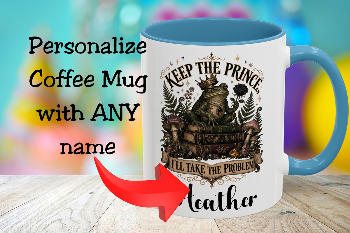 A white coffee mug with a blue handle and interior, featuring a vintage-style illustration of a bear on a train and the text 'KEEP THE PRINCE I'LL TAKE THE PROBLEM'. Large text on the left reads 'Personalize Coffee Mug with ANY name' with a red arrow pointing to the mug.