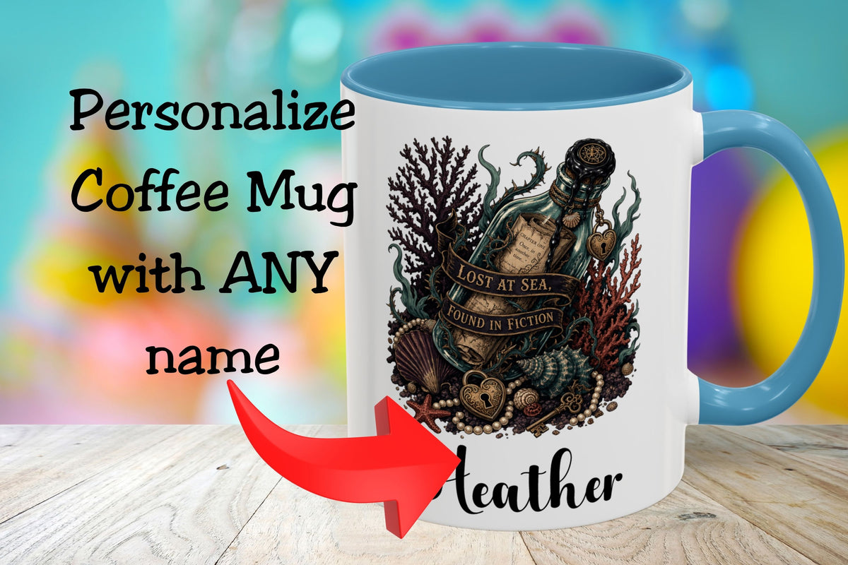 A white coffee mug with a blue handle and interior, featuring an underwater bottle illustration with the words 'Lost at Sea, Found in Fiction.' The mug is shown on a wooden surface with promotional text reading 'Personalize Coffee Mug with ANY name' and a red arrow pointing to the printed name 'Leather.
