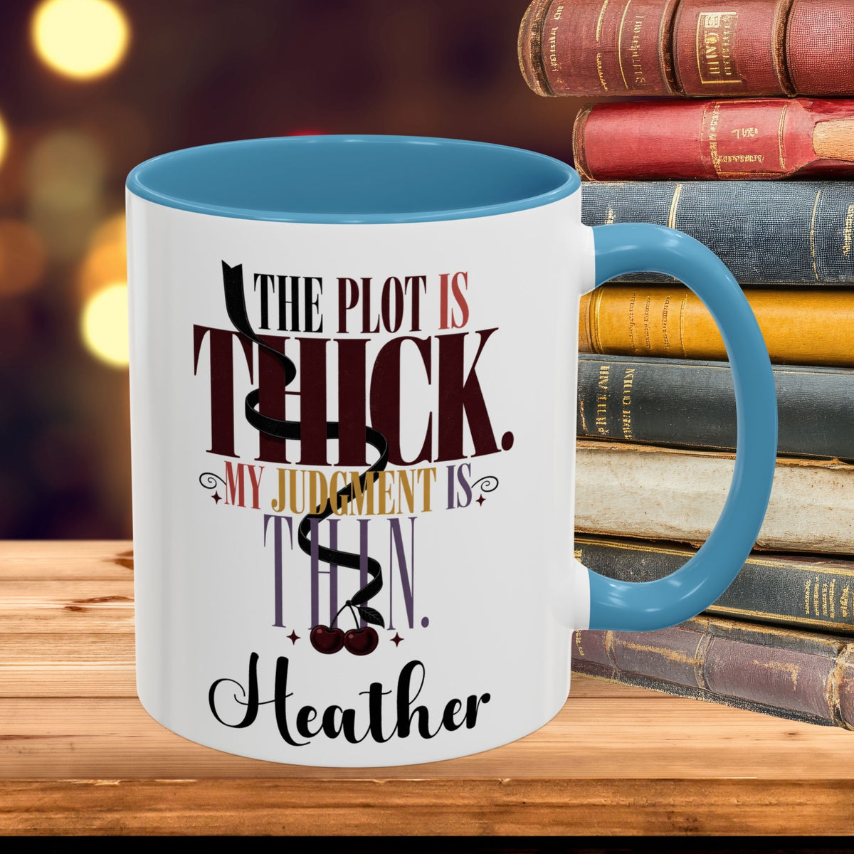 A white ceramic coffee mug with a blue interior and handle, featuring the quote 'THE PLOT IS THICK. MY JUDGMENT IS THIN.