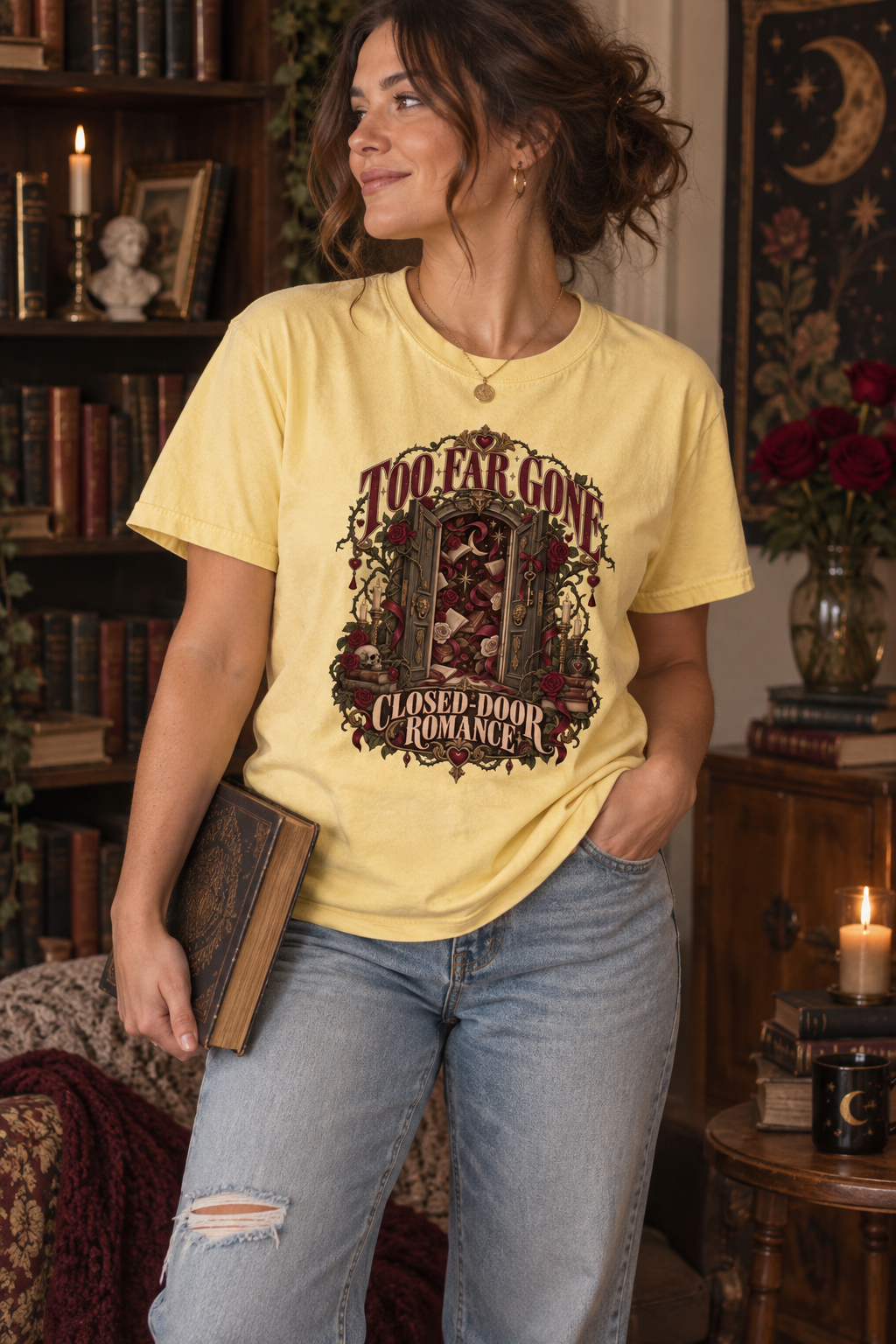 Too far gone—and happily staying there. This gothic “Too Far Gone, Closed-Door Romance” shirt features an ornate doorway surrounded by burgundy roses, antique books, candles, keys, and dark-academia details. A thoughtful gift for closed-door romance readers, sweet-romance fans, book club friends, librarians, and gothic book lovers. Available on a soft Comfort Colors tee for cozy reading days, bookstore visits, and book club nights. #BookLoverShirt #ClosedDoorRomance #BookishGift