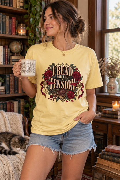Looking for the perfect gift for a slow-burn romance reader? This “I Read for the Tension” shirt features burgundy roses, flowing ribbons, heart-shaped locks, keys, and a vintage book on a soft Moss Comfort Colors tee. Its relaxed unisex fit makes it perfect for bookstore trips, book club meetings, library visits, author events, or cozy reading weekends. A thoughtful book lover gift for romance readers, romantasy fans, dark romance lovers, librarians, and anyone who lives for the banter, lingering looks, an
