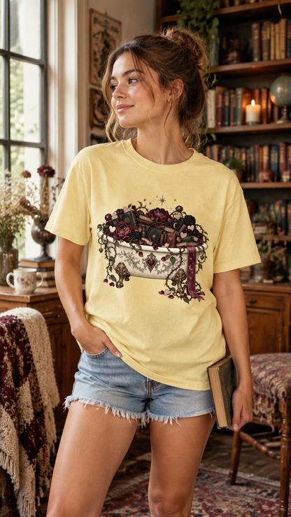 Create the perfect reading-day outfit with this romantic book lover shirt featuring a vintage bathtub overflowing with antique books, burgundy roses, dark florals, hearts, and celestial details. A thoughtful gift for romance readers, fantasy fans, librarians, writers, and book club friends. Perfect for bookstore trips, library visits, author events, reading retreats, or cozy weekends with your TBR.