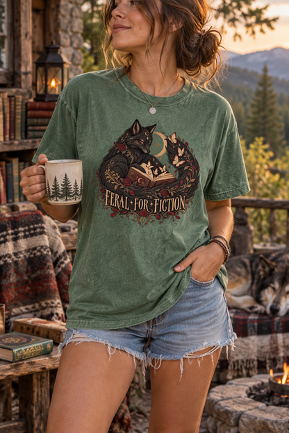 Celebrate your wildest reading obsession with this “Feral for Fiction” Comfort Colors shirt. Featuring two mystical black foxes curled around an open book with burgundy roses, butterflies, stars, and a crescent moon, this gothic book lover tee is perfect for dark romance readers, romantasy fans, BookTok friends, and dark-academia lovers. A unique reader gift for book club, bookstore trips, and cozy reading days.