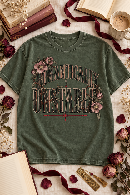For the dark romance reader who is completely stable—until a fictional villain enters the story. This “Romantically Unstable” Comfort Colors shirt features gothic lettering, thorny vines, and muted floral details on a soft, relaxed unisex tee. A fun book lover gift for BookTok readers, romantasy fans, book club friends, and anyone obsessed with morally gray characters. Available in Ivory, White, Butter, Moss, Pepper, and Blue Jean. #DarkRomance #BookLoverGift #BookishShirt