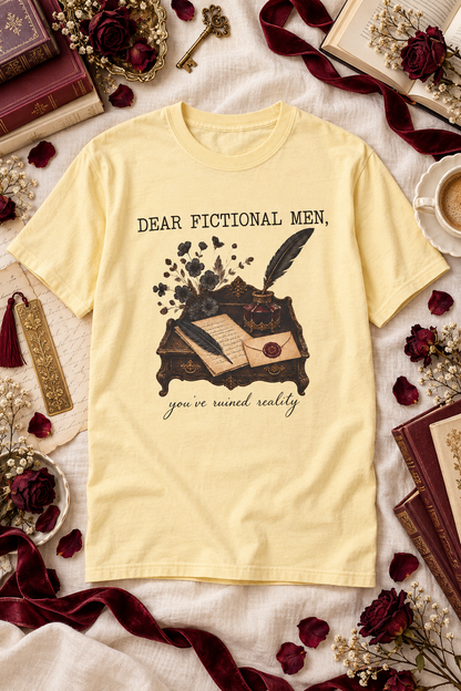 Fictional men ruined reality—and this shirt says what romance readers are already thinking. Featuring a vintage writing desk, handwritten letters, quills, dark florals, and the phrase “Dear Fictional Men, You’ve Ruined Reality,” this Comfort Colors tee makes a fun gift for dark romance readers, romantasy lovers, BookTok fans, and book club friends. Available in six colors. #DarkRomance #BookishShirt #ReaderGift