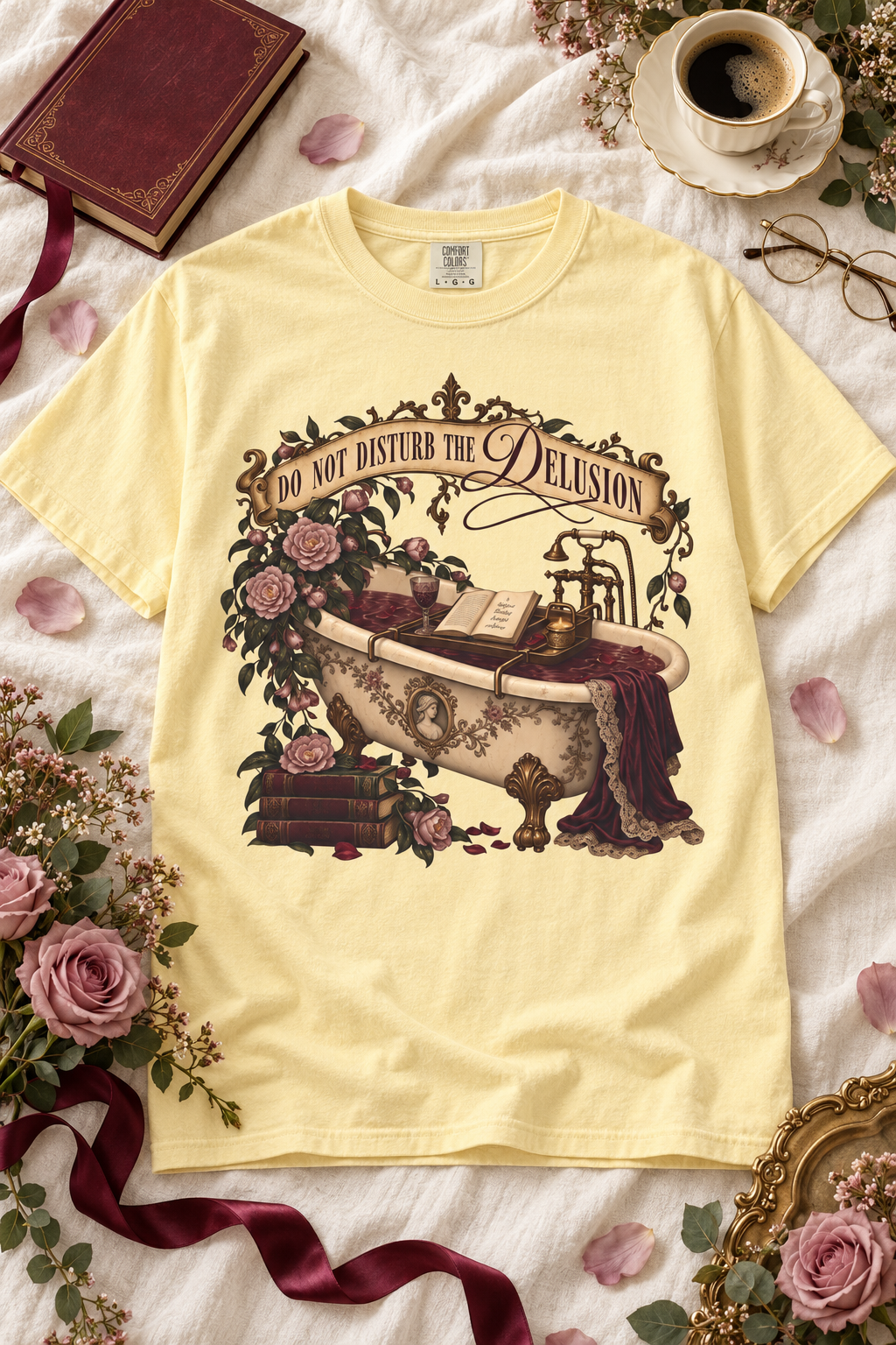 Do not disturb the delusion—the fictional world is better right now. This romantic gothic book lover shirt features an ornate antique bathtub surrounded by an open book, burgundy velvet, tea, vintage books, mauve roses, and beautiful brass details. The soft Comfort Colors tee has a relaxed unisex fit that is perfect for book club, bookstore trips, reading weekends, or cozy self-care days. A thoughtful gift for dark romance readers, romantasy fans, BookTok followers, librarians, and anyone who would rather b