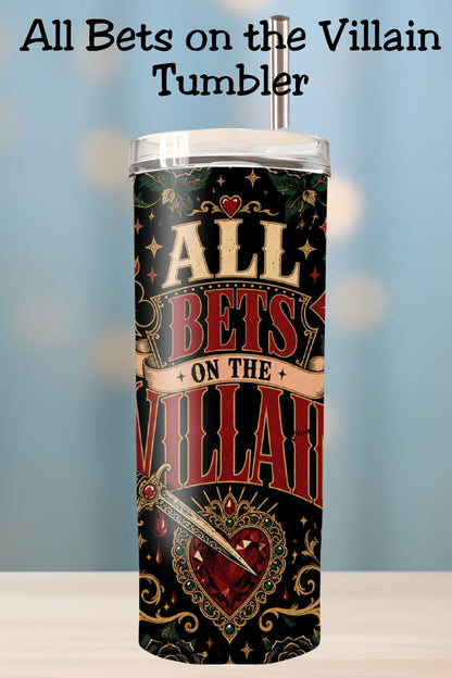 Hydration, but make it morally questionable. 🖤♥️ The All Bets on the Villain Tumbler features a bold gothic wrap with fiery card suits, black roses, cherries, ornate gold flourishes, a dagger, and a jeweled heart against a dramatic black background. Perfect for dark romance readers, romantasy fans, villain lovers, and readers who proudly choose fictional red flags. #BookLoverTumbler #DarkRomance #VillainEra #AllBetsOnTheVillain #RomantasyReader #BookTokGift #ReaderLife #BookishGift