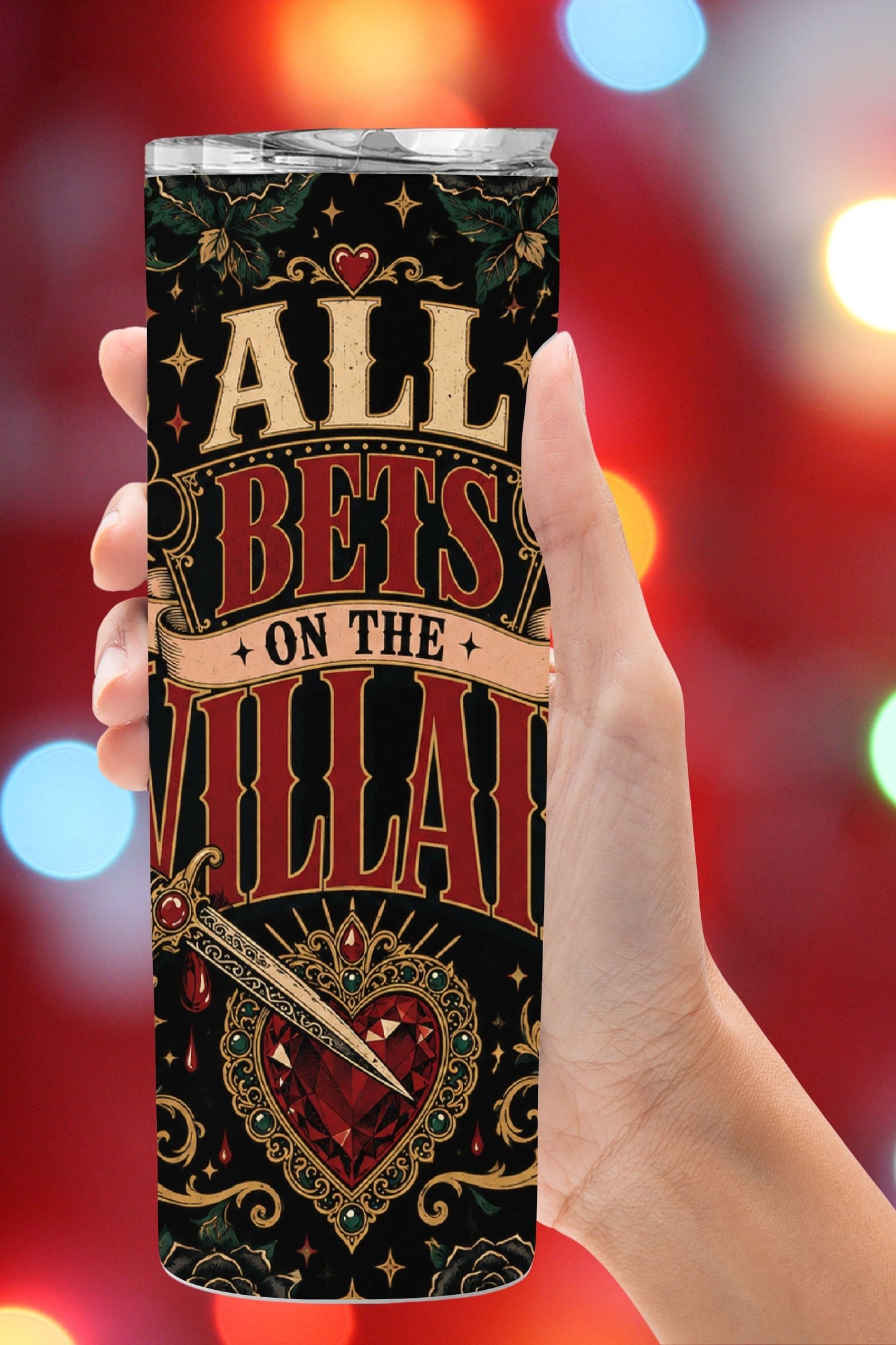 Hydration, but make it morally questionable. 🖤♥️ The All Bets on the Villain Tumbler features a bold gothic wrap with fiery card suits, black roses, cherries, ornate gold flourishes, a dagger, and a jeweled heart against a dramatic black background. Perfect for dark romance readers, romantasy fans, villain lovers, and readers who proudly choose fictional red flags. #BookLoverTumbler #DarkRomance #VillainEra #AllBetsOnTheVillain #RomantasyReader #BookTokGift #ReaderLife #BookishGift