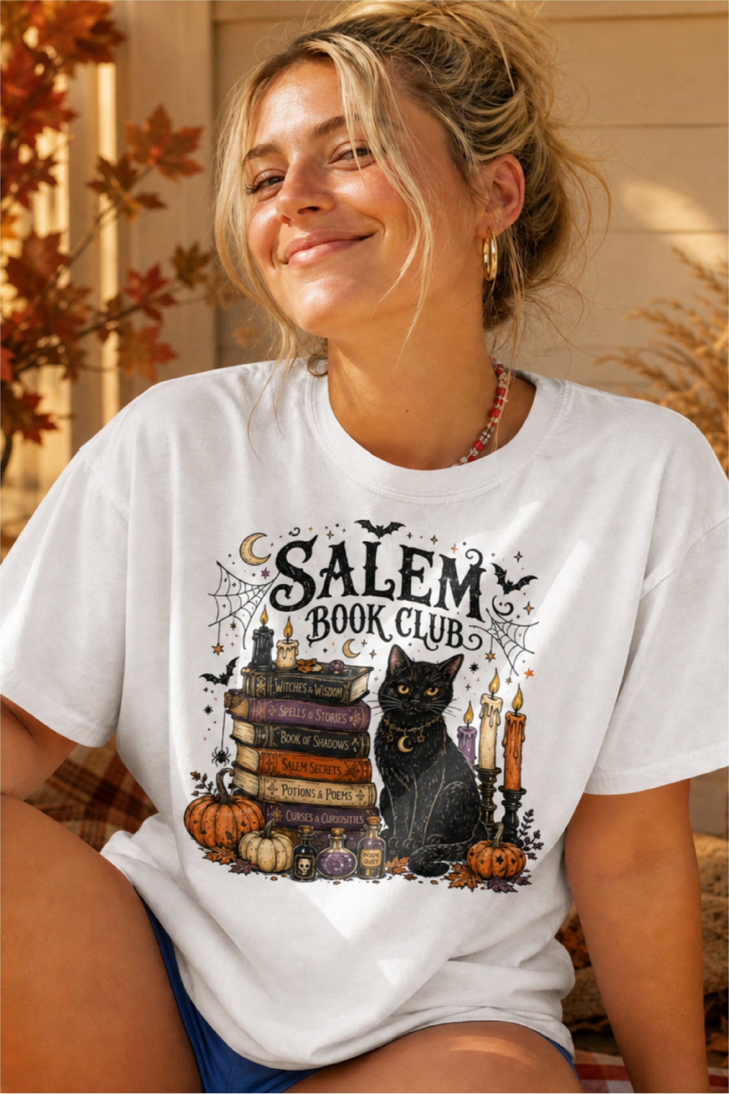 Calling all spooky readers! 🖤📚 The Salem Book Club shirt is the perfect Halloween tee for book lovers who can't resist black cats, witchy vibes, candlelit reading nights, and magical stories. Featuring a charming black cat, vintage spell books, pumpkins, potion bottles, spider webs, bats, and cozy autumn details, this Comfort Colors shirt is made for BookTok fans, book club meetings, bookstore visits, Halloween parties, and all your fall adventures. A fun gift for readers, librarians, teachers, fantasy lo