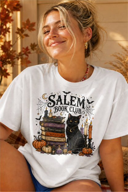 Calling all spooky readers! 🖤📚 The Salem Book Club shirt is the perfect Halloween tee for book lovers who can't resist black cats, witchy vibes, candlelit reading nights, and magical stories. Featuring a charming black cat, vintage spell books, pumpkins, potion bottles, spider webs, bats, and cozy autumn details, this Comfort Colors shirt is made for BookTok fans, book club meetings, bookstore visits, Halloween parties, and all your fall adventures. A fun gift for readers, librarians, teachers, fantasy lo